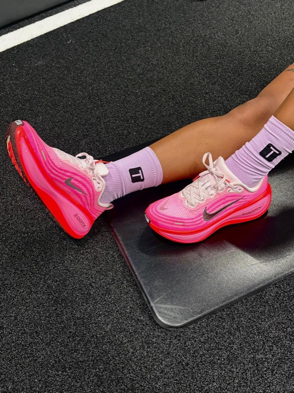 Lilac TRED socks with pink trainers on the gym floor